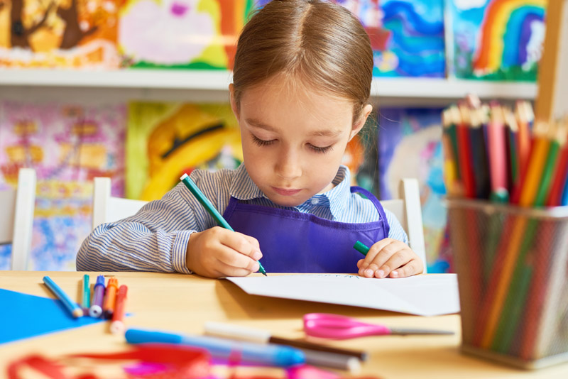little-girl-drawing-in-pre-school-HQEMYWC.jpg